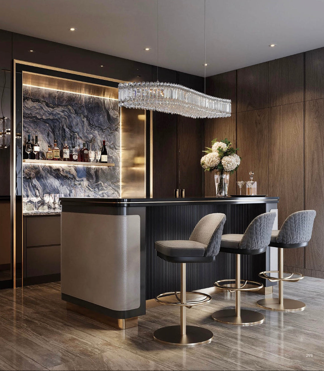 Modern luxury home bar with an HDLS crystal linear chandelier, marble backsplash, elegant bar stools, and warm ambient lighting.