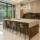 Modernus Linear chandelier installed above a luxury kitchen island with marble finishes, warm lighting.