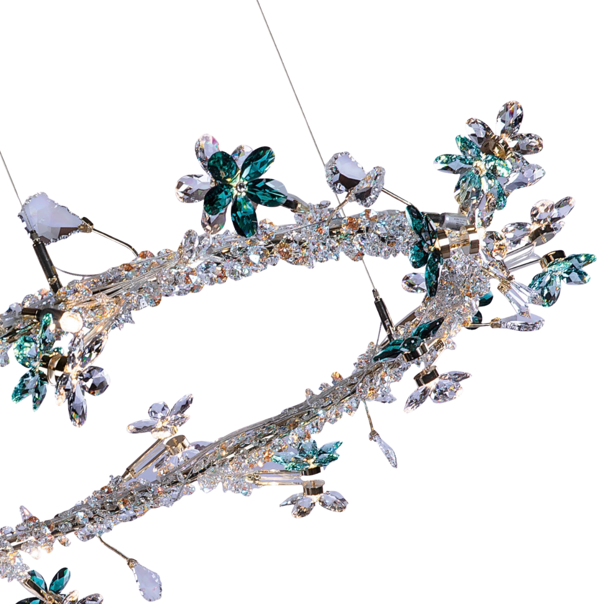 Close-up of Swarovski® crystal detailing in a luxury HDLS lighting design showcasing brilliance and precision cuts.