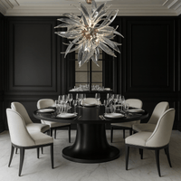 Helios chandelier illuminating a high-end dining room with round black table and modern white chairs.