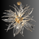 Sculptural Helios chandelier with layered glass blades arranged in a sunburst form on a black backdrop.