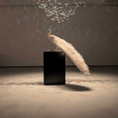 Full-length Swarovski crystal peacock sculpture displayed on pedestal in elegant studio lighting.