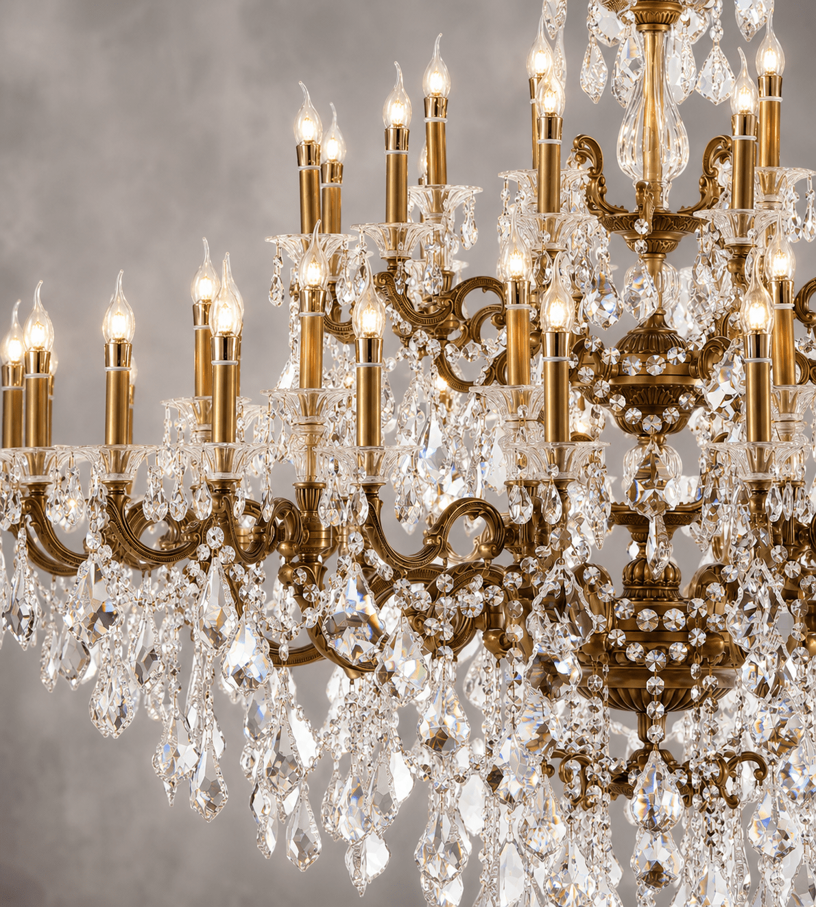 Imperial Grace Éclat crystal chandelier close-up with bronze frame, candle lights and faceted crystal drops