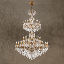 Imperial Grace Éclat multi-tier chandelier with bronze-plated copper frame and Asfour crystals, in a grand interior setting.