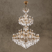 Imperial Grace Éclat multi-tier chandelier with bronze-plated copper frame and Asfour crystals, in a grand interior setting.