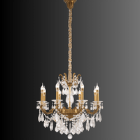Imperial Grace Petite chandelier with bronze arms and crystals on dark gradient background.