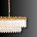 Close-up of the La Scala Crystal Barone chandelier showing gold-plated copper detailing and hand-cut crystal prisms.