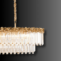 Close-up of the La Scala Crystal Barone chandelier showing gold-plated copper detailing and hand-cut crystal prisms.