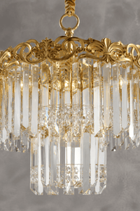 Close-up of La Scala Crystal Contessa luxury crystal chandelier with 18K gold-plated frame and clear crystals