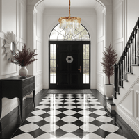 La Scala Crystal Contessa chandelier illuminating elegant foyer with 18K gold and crystal brilliance.