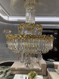 La Scala Crystal Sovrano chandelier in luxury living room with gold accents.