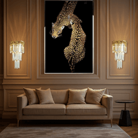 La Scala Crystal Visconte wall lamps installed above a luxury living room sofa, illuminating a classic interior.