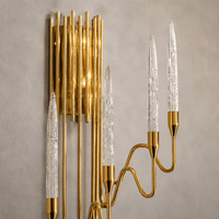 Close-up of Luce di Roma Foro luxury gold crystal wall sconce with champagne crystal and 18K gold finish