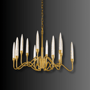 Hestia chandelier illuminated against a dark background, highlighting gold-plated frame and champagne crystal spires.