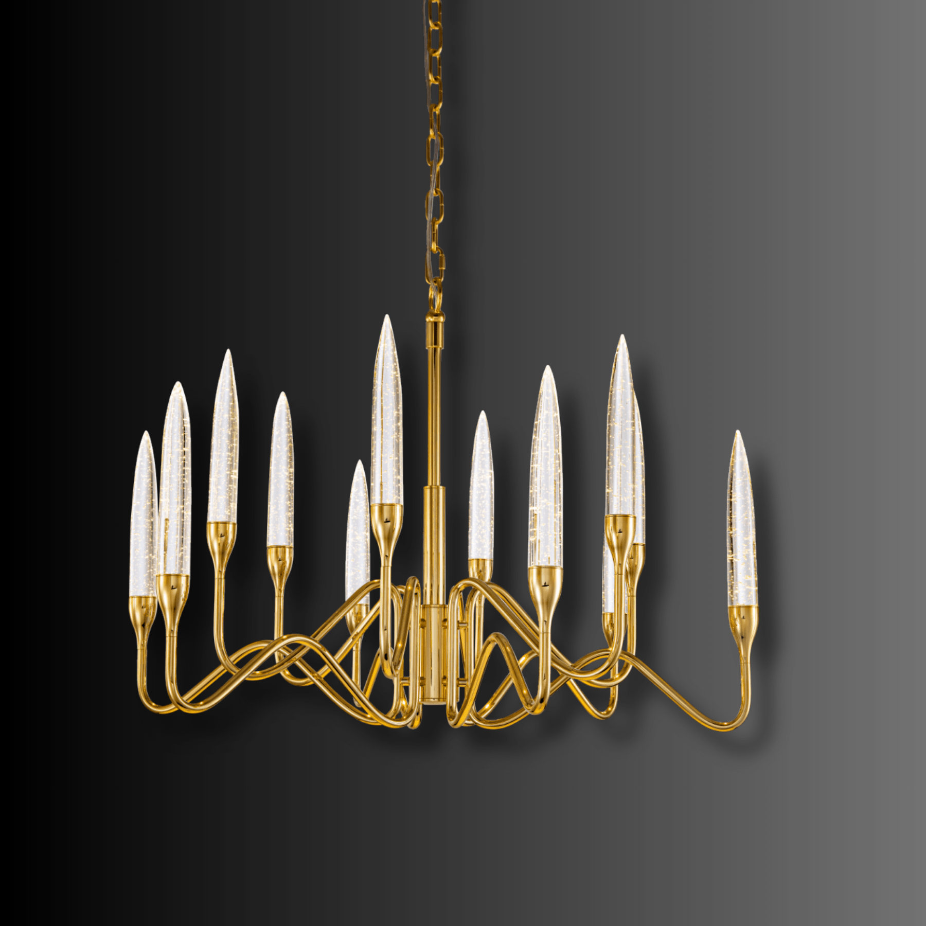 Hestia chandelier illuminated against a dark background, highlighting gold-plated frame and champagne crystal spires.