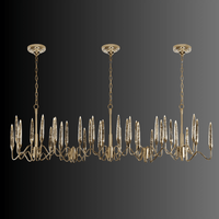 Long 218 cm Luce di Roma Vesta chandelier featuring 35 gold arms and champagne Asfour crystal spires on a dark background.