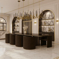 Luce di Roma Vesta chandelier installed above a dark glass dining table, 18K gold frame and champagne crystal spires.