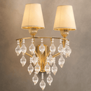 Close-up of Luce Regale Avorio Applique gold wall lamp with ivory shades and crystal drops.