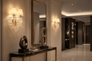 Pair of Luce Regale Avorio Applique wall lamps illuminating a luxury Manhattan hallway.