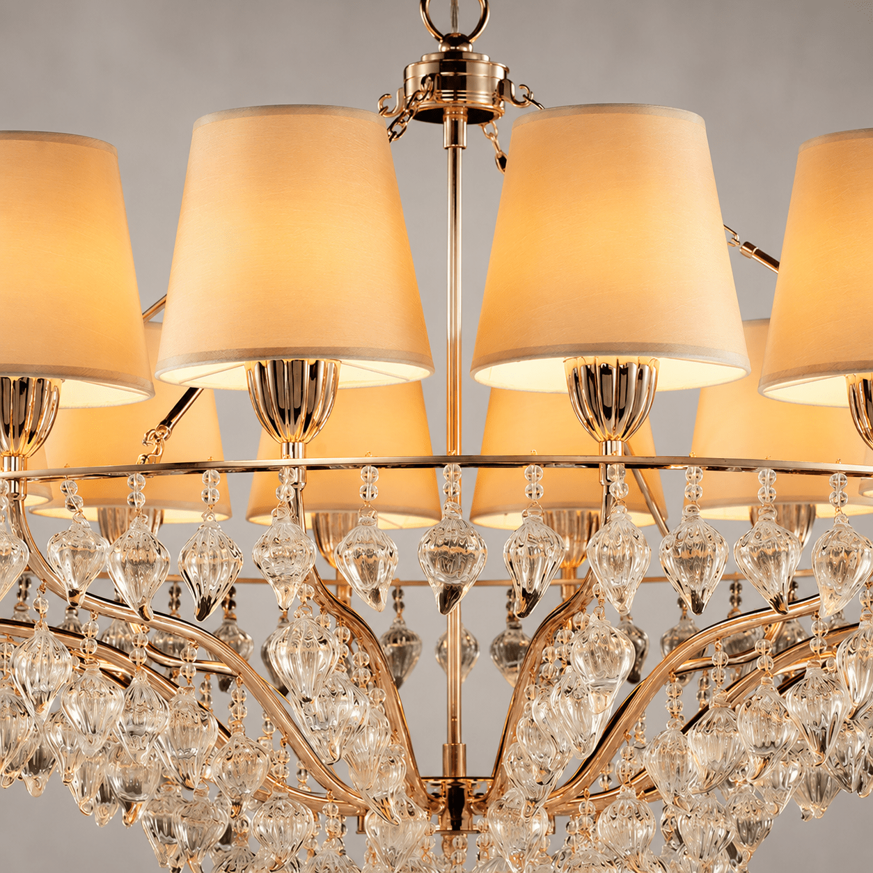 Close-up of Luce Regale Avorio Magnifica chandelier with ivory shades and sculpted glass drops