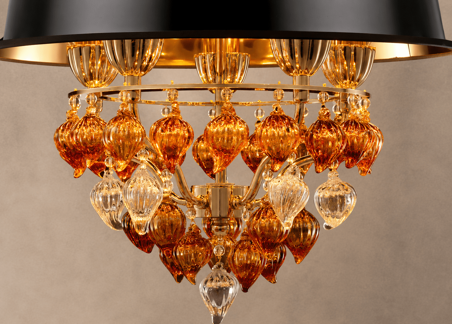 Close-up of Luce Regale Donatello Piccolo with Murano-style amber glass and 18K gold-plated details