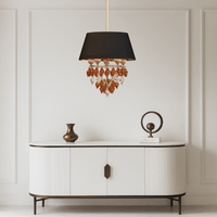 Donatello Piccolo chandelier styled above a console table, showcasing black shade and Murano-style glass drops.