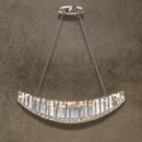 Lucerne Arc large linear crystal chandelier with curved silhouette, lead-free crystal prisms and polished steel frame.