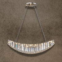 Lucerne Arc large linear crystal chandelier with curved silhouette, lead-free crystal prisms and polished steel frame.