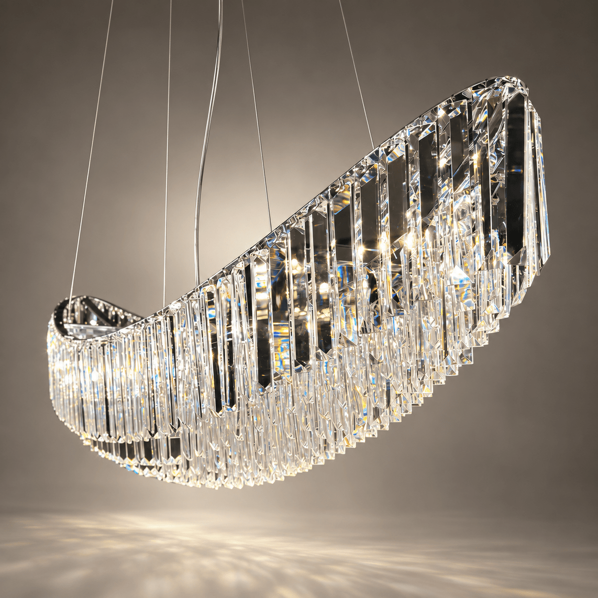 Close-up of Lucerne Arc chandelier showing layered A+ lead-free crystal prisms along its sweeping stainless steel frame.