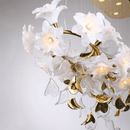 Detail of sculpted magnolia glass petals and gold leaf accents, emphasizing the chandelier’s Murano-style artistry.