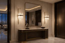 Pair of Manhattan Axis crystal wall sconces beside a mirror above a console in a luxury penthouse entrance.