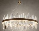 Close-up of Manhattan Halo Crystal Chandelier with clear faceted crystals, leather band and warm gold light.