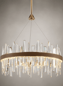 Close-up of the Manhattan Orbit Crystal Chandelier with clear crystal prisms, leather band and warm gold light.