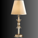 Maria Eleganza 18K gold and Asfour crystal table lamp displayed on a dark background with illuminated ivory fabric shade.