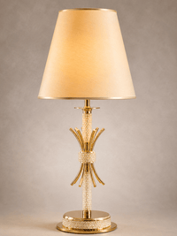 Close up shot of the Maria Eleganza Table Lamp showing the crystal and gold details against grey background.