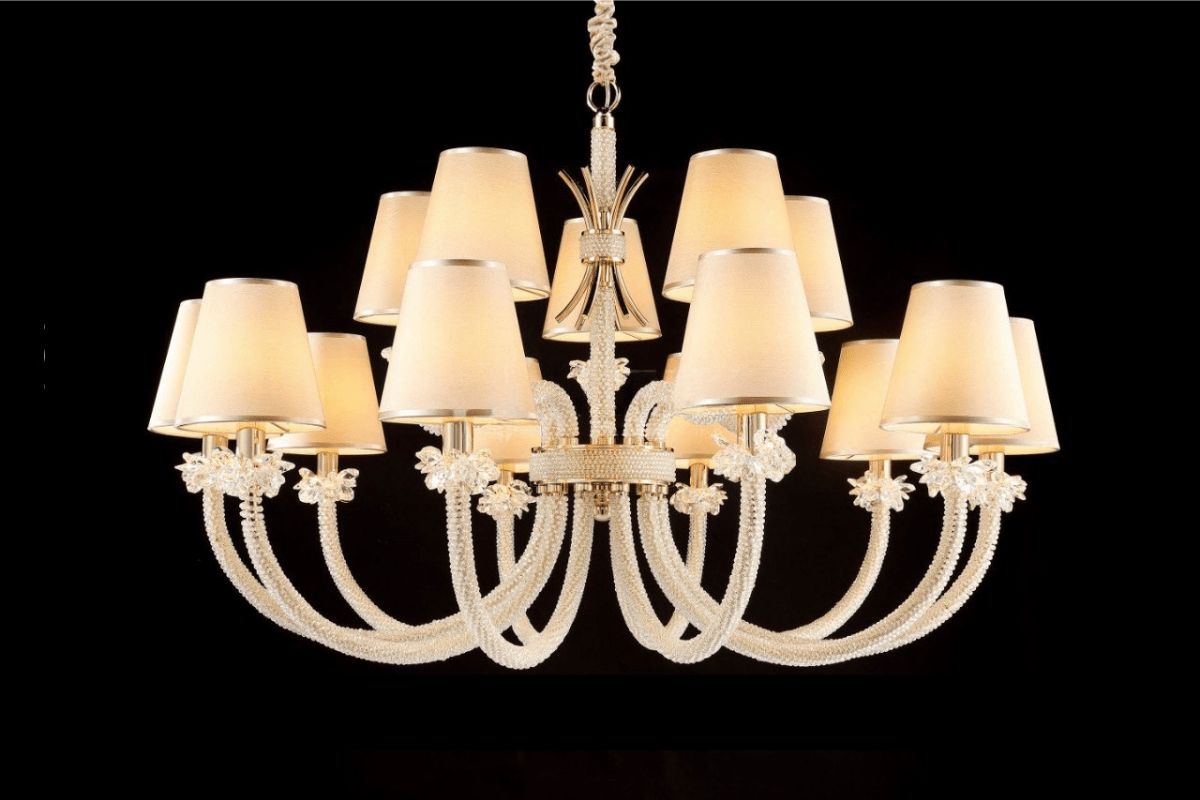 Hero image of the Maria Grandeur 15-light chandelier with ivory shades and crystal-wrapped arms shown on a black background.
