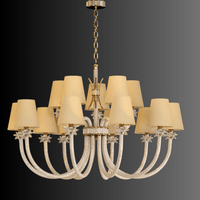 Maria Grandeur 15-light chandelier with gold-plated frame and crystal-wrapped arms displayed on dark gradient background.
