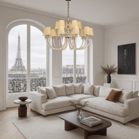 Maria Grandeur chandelier installed in a Parisian living room with Eiffel Tower view, with elegant 15-light crystal design.