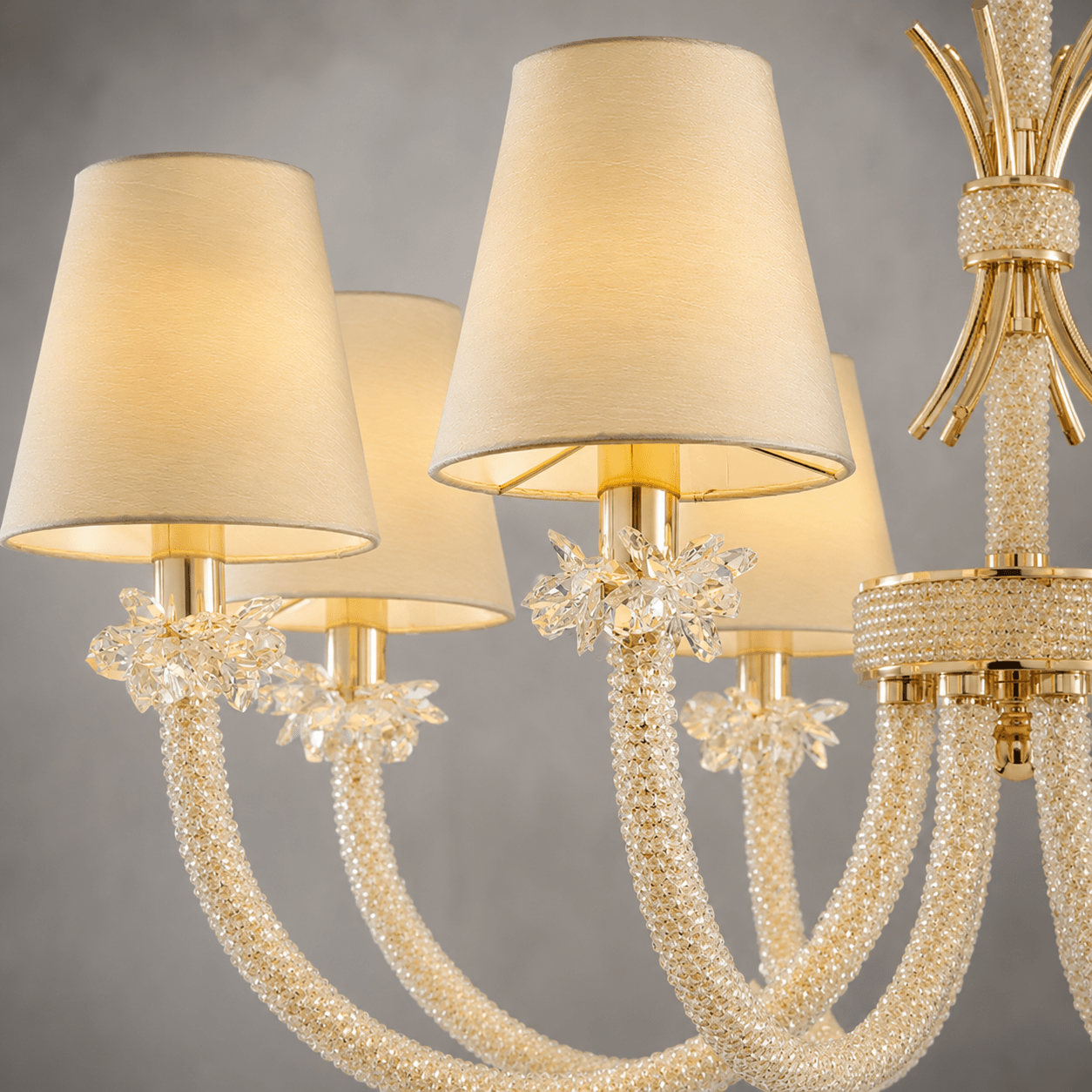 Close-up shot of crystal arms and fabric shade of Maria Luxe 8 lights chandelier