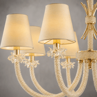 Close-up shot of crystal arms and fabric shade of Maria Luxe 8 lights chandelier