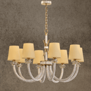 Maria Luxe 8-light gold crystal chandelier with ivory shades and Asfour crystal arms, shown against a grey wall background.