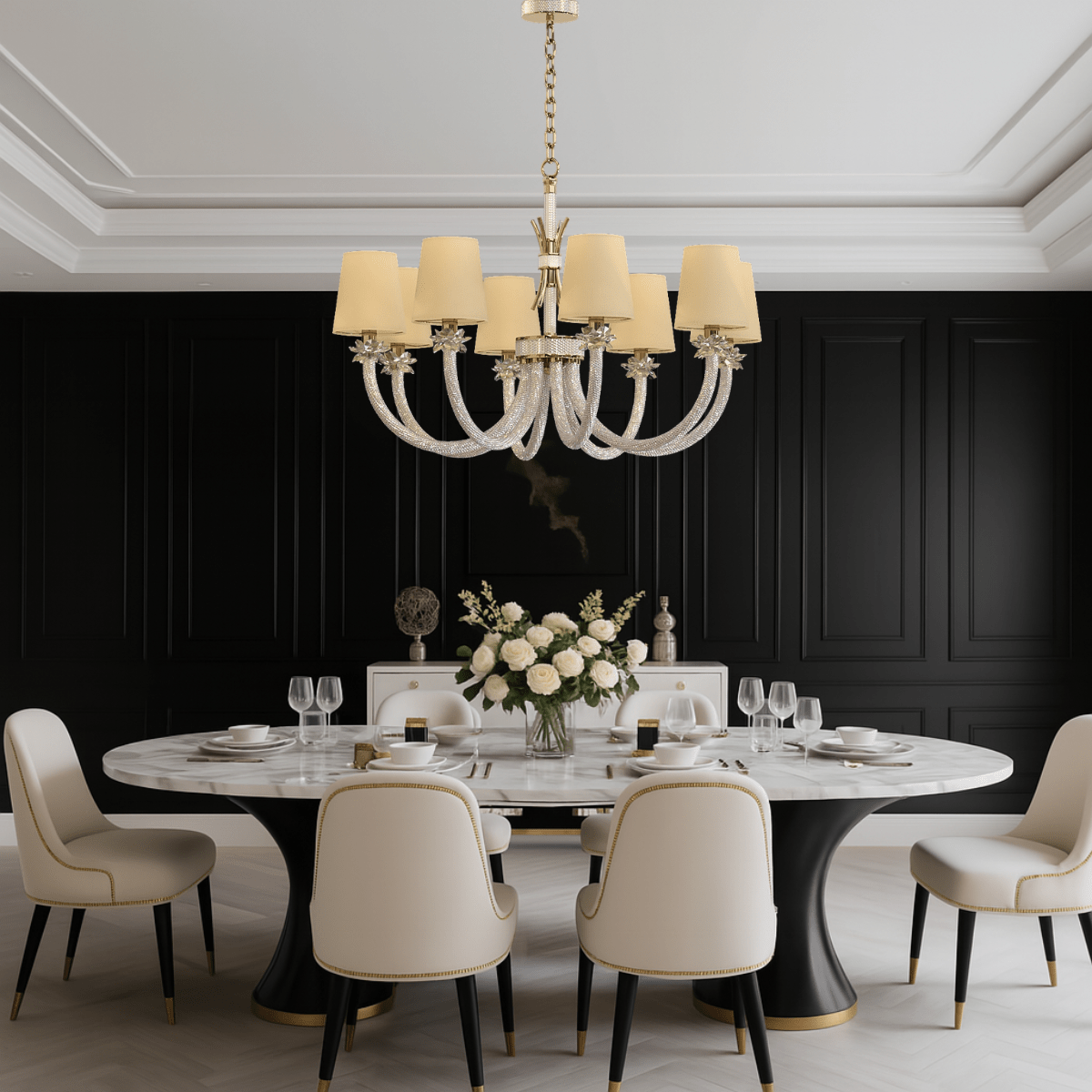 Maria Luxe chandelier hanging above a luxury dining table with cream chairs, with 8-light crystal and gold design.