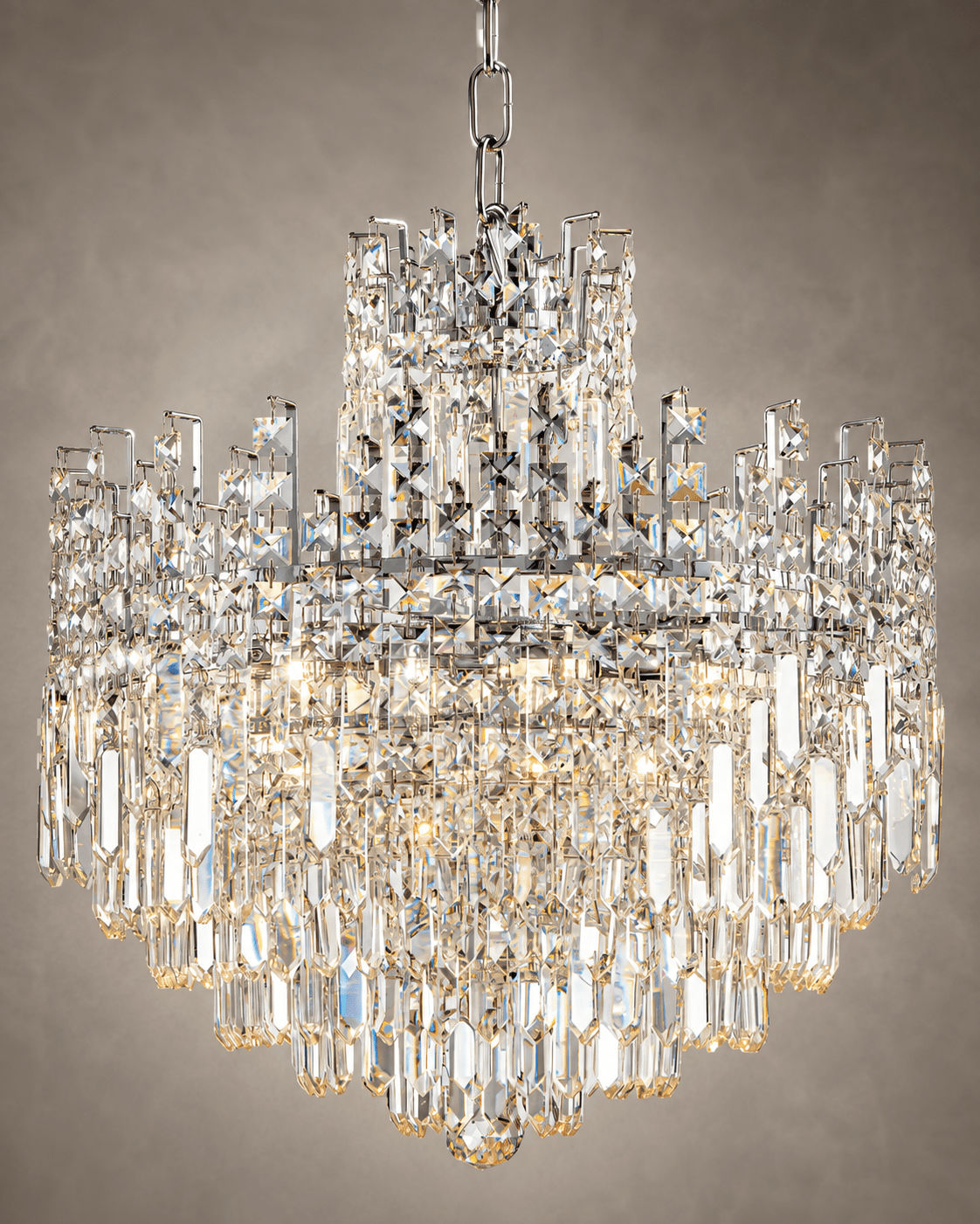 Close-up of Maurice Argent chrome crystal chandelier with tiered prisms and polished metal frame.