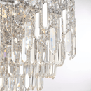 Macro close-up of Maurice Argent chandelier crystals showing layered Asfour crystal rods and light refraction details.