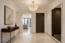 Maurice Doré gold crystal semi-flush chandelier installed in a luxury Chelsea apartment entrance.