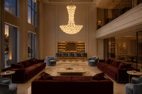 Modernus Grande large glass chandelier installed in a private club Miami with burgundy and bly sofas, marble floor and bar.