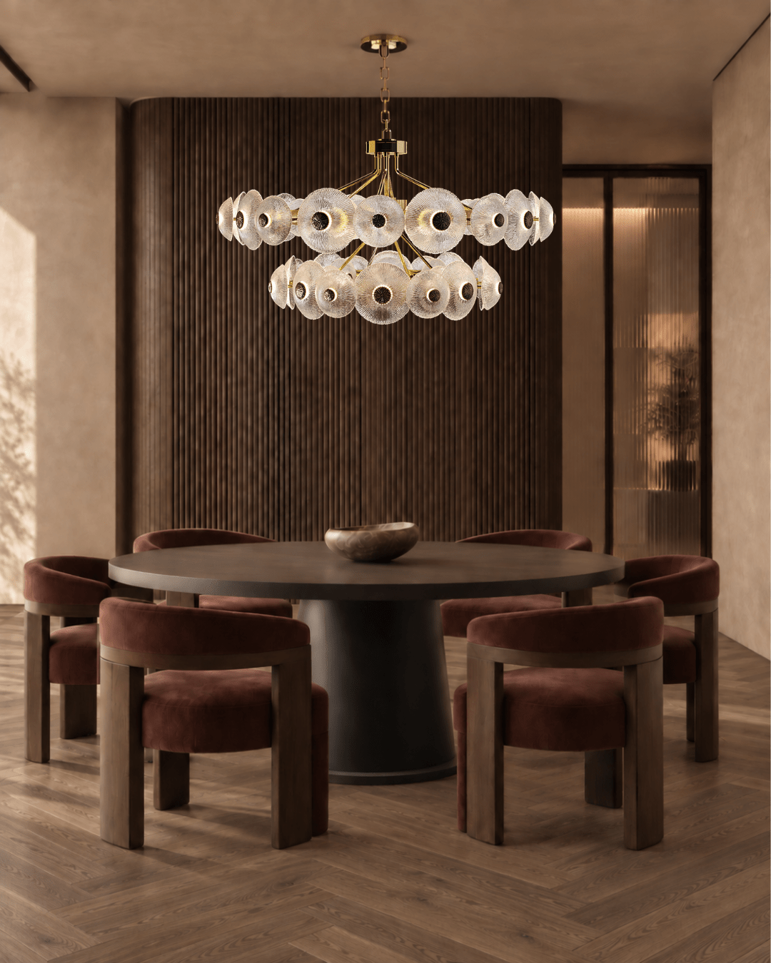 Modernus Halo art glass and copper chandelier by HDLS Lighting above a round table in a warm contemporary dining room.