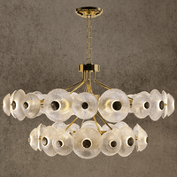 Modernus Halo chandelier with layered Murano-style glass discs and gold frame for luxury interiors.