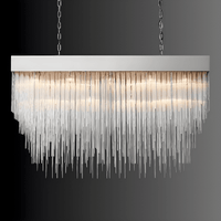 Front view of Petra Argent rectangular chandelier, silver body with hand-set glass rods for refined interiors.