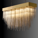 Angled view of the Petra rectangular chandelier featuring brass canopy and cascading architectural glass rods.